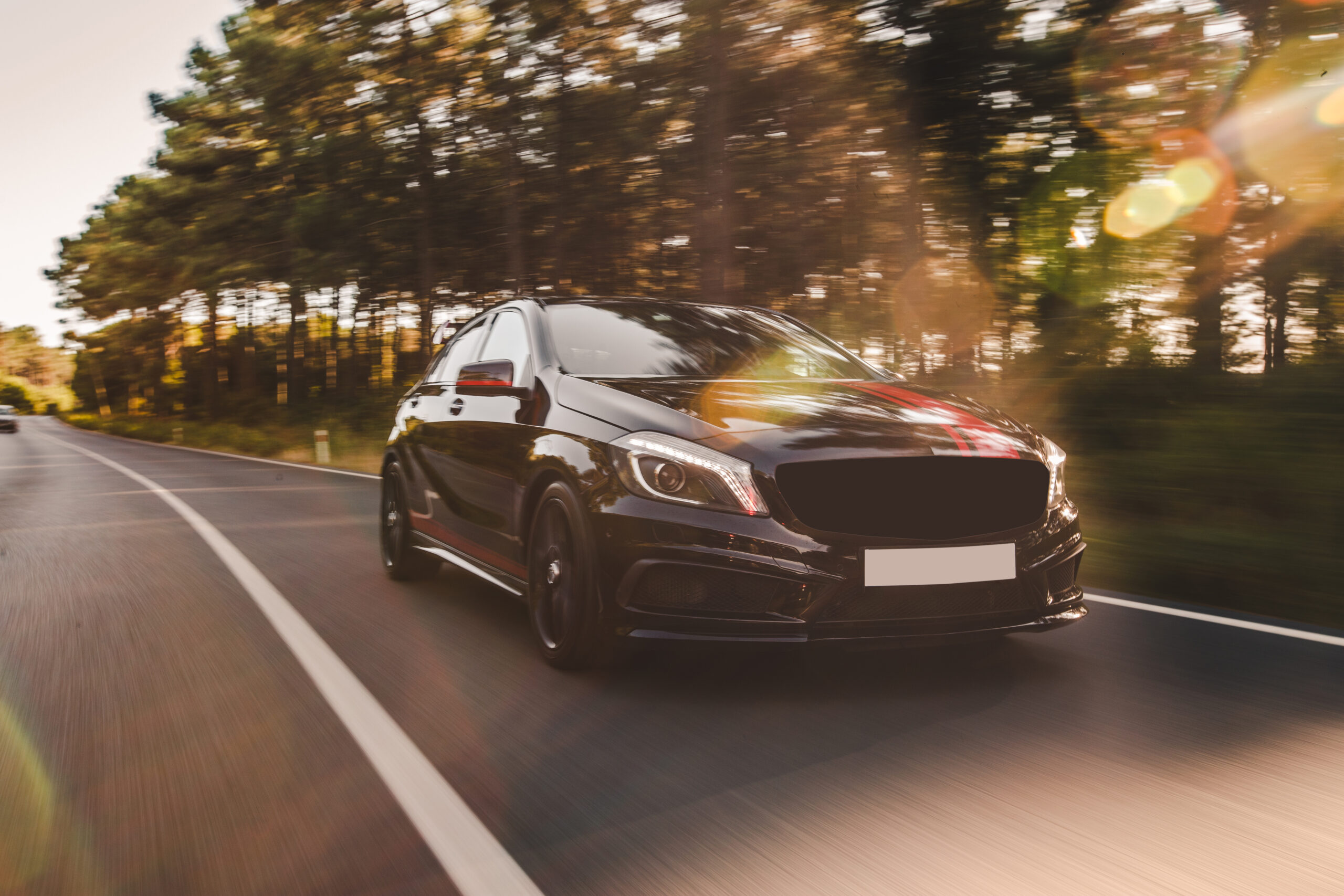 front-view-black-luxury-sedan-road front-view-black-luxury-sedan-road